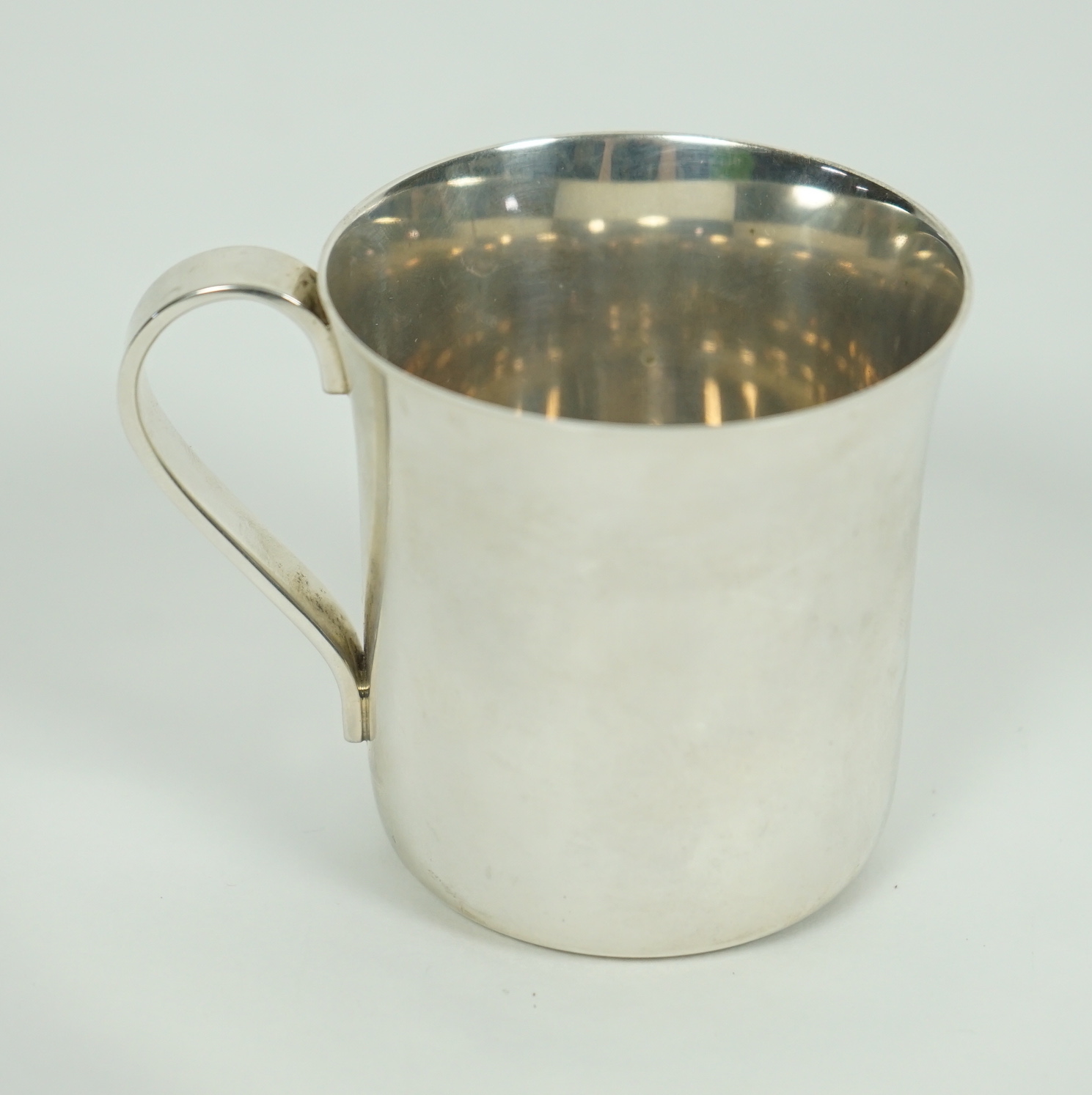 A modern Tiffany & Co sterling 925 christening mug, numbered 23245, height 6cm, 3.4oz, with Tiffany & Co box.